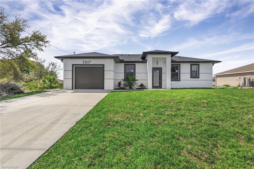 Seller is motivated and ready to make a deal! 10 Year Structural Warranty and 3% seller credit toward buyer’s closing costs with full-price offer. 100% completed and ready to move-in. Be sure to click on the 3D virtual tour! This beautifully designed new construction home sits on a corner lot and offers a modern living space. Featuring 3 bedrooms, 2 bathrooms, and a 1-car garage, the home includes 10-ft ceilings, hurricane-impact windows and doors, built-in closets and washer/dryer installed! Enjoy 32x32 porcelain tile flooring throughout, high-profile baseboards, and a spacious kitchen with custom cabinetry, quartz countertops, and a full suite of Samsung stainless-steel appliances. Bathrooms showcase quartz finishes, glass shower doors, and premium fixtures. The property also includes a full irrigation system. Surrounded by new homes, this residence combines style, quality, and value. Don’t miss your chance!