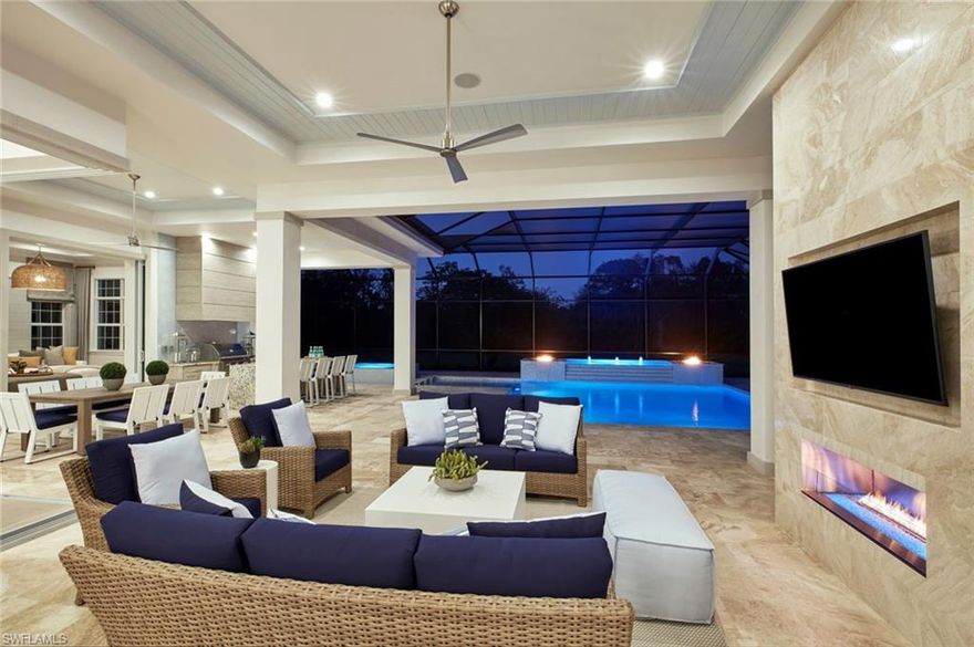 At Stock Custom Homes we understand that the Home You Live In Has Never Been More Important. READY FOR IMMEDIATE OCCUPANCY. Pine Ridge Estates is perfect for families who desire room to move! Stock's Fully Furnished Estate home offers beautiful indoor/outdoor living on 1.28 acre lot with lots of privacy. Great Room concept. Four  ensuite bedrooms, bonus room that could be used for home schooling, second office, or home gym. Kitchen with expanded one level island and separate walk-in pantry. Custom designed cabinetry. Quartz counter tops and matching full height backsplash. Stainless Steel appliances with Gas cooktop, microwave/wall oven combination, dishwasher, stainless hood insert with cabinet surround detail, and 36” Built-in French door refrigerator. Luxurious Master Suite with wood flooring, coffer ceilings with unique molding detail, and sitting area with French doors opening to covered outdoor living. Full outdoor kitchen, Salt Generating Pool with Intellitouch Control, raised deck and spa, sun shelf, deck jets, lighted bubblers, and linear fire ring. Pool deck, lanai and fireplace surround with 16” x 16” Queen Beige Travertine. Panoramic pool cage. LIVE YOUR BEST LIFE HERE!