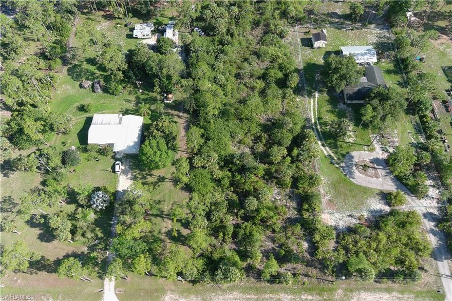 Upland 2.27 acres located on the south side of 4th avenue NE. No wetland permit required! You won’t find a more attractively priced upland lot in the estates especially with a location like this. Just 2 streets north of the new commercial activity center at the intersection of Golden Gate Blvd. and Everglades Blvd. Vanderbilt Extension is planned to extend out to Everglades so a trip to the beach will be in  a few short minutes. Collier County is also planning a new park on the Vanderbilt Beach extension as well as a school. DEP report on file.