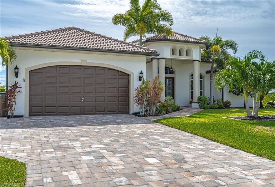 Beautifully appointed 3 bedroom plus Den/2 bath Gulf access pool home. The home is ideally situated on intersecting canals which affords amazing water views from the great room, kitchen, breakfast nook, master and guest bedroom, lanai, saltwater infinity-edge pool and dock with tiki hut. The light and bright interior has been updated to include new tile flooring in main living areas, kitchen cabinetry, stainless appliances, granite counters, and large breakfast bar. The great room has triple sliders that open to the large covered lanai to bring the outdoors in. Baths have been updated with granite counters and vessel sinks. There are many quality architectural details throughout the home to include soaring tray ceilings in main living areas, arches, pillars and plant shelves. Tastefully decorated in soothing neutral tones throughout. This home has it all from its great curb appeal with its newly paved drive and walkways and gorgeous palm trees to the phenomenal views and boating access via Matlacha to the gulf. Great location perfect for commuters to Lee or Charlotte counties. Don't let this one get away. Call to schedule your private viewing today!