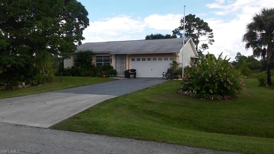 CUTE AND COZY single family home on .4 acres of land.  Plenty of room for a pool, build a garden, the possibilities are endless!  3 bedrooms, 2 bathrooms with screen lanai/porch and Pergola for perfect sitting and to enjoy the view.  Well maintained home and a lots of possibilities.  NEW reverse osmosis system under kitchen sink, AC serviced and maintained in 8/2016 with all ducts cleaned and sanitized.  Home is READY for new owner!