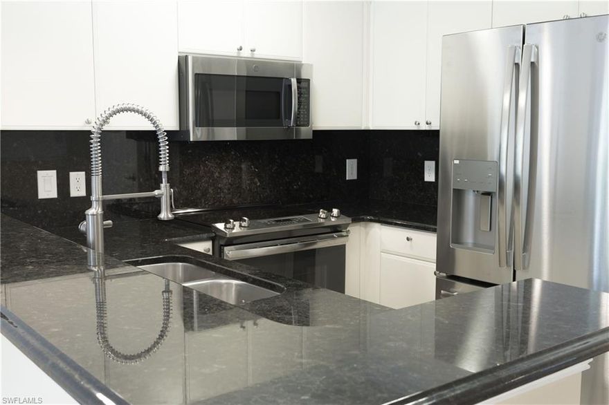 Mr. and Mrs. Clean welcome you to this luxurious and very well kept residence featuring: New Appliances (With transferable warranty), New Blinds, New Paint, New Fans, 2015 AC, 2015 Front Loader Washer/Dryer, New Kitchen Sink and Faucet, New Front Door, New Garbage Disposal, New Screens On Lanai, All Granite Kitchen with custom Granite backsplash, Custom Crown Molding, Chair Rail molding, Door frame moldings, and Luxury Bathroom Showers. Beautiful matching Tile throughout the entire condo and Impact Windows featured in all the bedrooms. This level of luxury and beauty is unmatched at Botanical Place! Walk and bike on Bayshore, only 2 miles to 5th Ave and beach! Naples Botanical garden and Celebration food truck park along with public boat launch and Sugden regional park are within a mile.  Call today for your private showing!