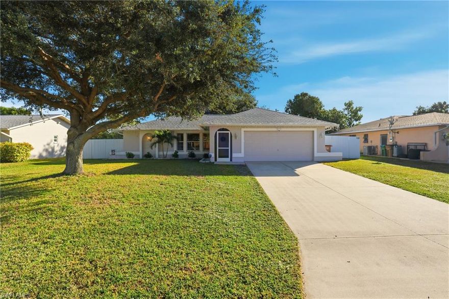 Welcome to this beautifully updated Cape Coral home, offering move-in-ready living in a prime location just minutes from shopping, dining, and Fort Myers. All assessments are paid, and no flood insurance is required—what more could you ask for?

Step inside to a bright, open layout with high ceilings, a split-bedroom design, and beautiful neutral gray flooring throughout. The updated kitchen and refreshed bathrooms provide modern style and functionality.

The garage features an epoxy floor and mini-split A/C, ideal for a workshop, hobby space, or climate-controlled storage— the possibilities are endless! Outdoors, enjoy a huge, fully fenced backyard with plenty of room for a pool or entertaining, all in a quiet neighborhood with no HOA.

This meticulously maintained home delivers comfort, versatility, and convenience. Schedule your private showing today—this one won’t last!