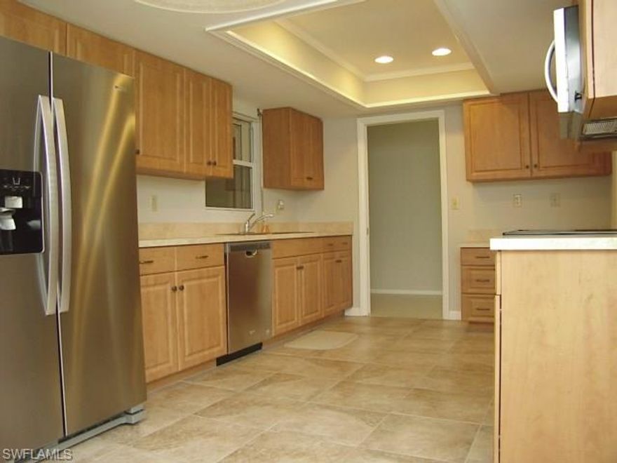 Fabulous location just 5 blocks from the Clubhouse and only 110 feet from the private courtyard pool. Highly maintained and move-in ready, this home has all brand new stainless appliances,  all new AC installed in 2016 and thermal double pane insulated windows. Open lanai area with triple sliders and under central AC.  Large eat-in kitchen provides tons of storage with newer cabinets and a computer desk. The lower cabinets have sliding shelves. Spacious master bedroom measures 17 x  12 feet and offers 2 double closets along the entire width of one wall. The guest bathroom has a fresh new vanity, sink and new toilet. Laundry room has a wet sink and a large storage counter/cabinet for ease in folding clothes. The two car garage is large enough for 2 vehicles or a car and a golf cart and has a newer hurricane rated overhead door. The windows and sliding doors in the home have electric roll down hurricane shutters for quick and easy peace of mind. Hurricane ready in just minutes! HOA is $330/month+covers all roof replacement costs. Seller knows of no defects and invites the pickiest of Buyers. Price, value and location make this one an easy choice.