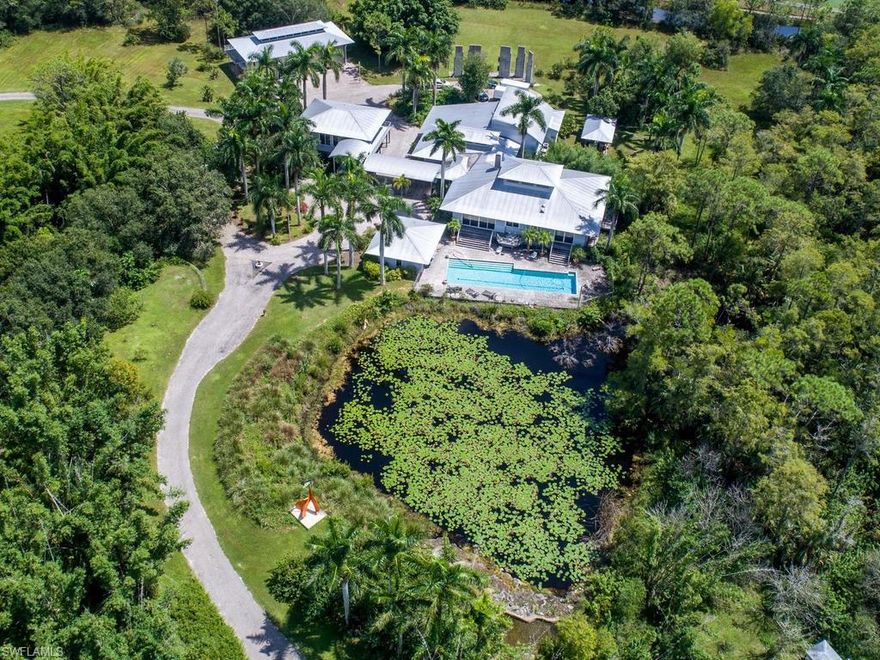 With Showing Request - Please submit Pre-Qualifying Letter or Proof of Funds. Private gates open to a lush courtyard under 40-foot palm trees with parking for 30 cars. Inside, 14ft doorways with imported doors, tall ceilings, custom fireplaces and floors of bamboo and stainless steel. Between the main house and two-story guesthouse, this architecturally designed home with 10 acres of land is centrally located to all schools, airports, beaches, dinning and entertainment. Unparalleled privacy and the ultimate entertainment space or purchase all 35 acres for $6.6 Million. This expansive open floor plan with high-vaulted ceilings, skylight windows that enables natural light to cascade throughout the house, no matter the weather. Home includes a gourmet stainless steel kitchen with Double-Viking Gas Stoves, and Double Dishwashers, Wood-Burning Fireplace, Entertainment Area, upstairs office, with two other smaller kitchens in home and guest house The cabana has sauna and steam-shower with a salt-water lap pool set against the backdrop of the private pond and state-of-the-art security system. Survey Available Upon Request.