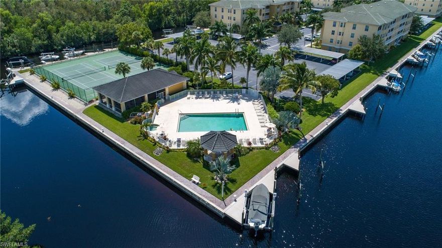 This is the one you've been looking for & won't last long... 25' Boat slip with Boat lift and dock box is included with this amazing third floor condo. Conveniently located within walking distance to the club house & amenities. Island Cove is nestled in an quite gated waterfront peninsula can be described as a well maintained community with lush landscaping, large heated community pool, spa, propane BBQ area, club house, pickle ball & tennis courts. Enjoy the short car ride or bike ride to shopping & restaurants! Private view from the screened balcony overlooking your sailboat Gulf access canal. This floorplan offers an open great room with 3 bedroom and 2 bathrooms, featuring many options such as Coffered ceilings, an open & spacious kitchen with pantry, accented by spacious eating area. The master suite offers access to your private screened in balcony, two large walk in closets, a linen closet, & a spacious master bath with walk-in shower. Enjoy a relaxing evening in the large & open great room overlooking the view or enjoy the sunsets or sunrises by the community pool, spa, & amenities center. (A/C and Flooring 1yr old).  Set up a showing today, association does allow pets!