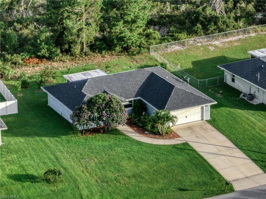 Welcome home to this beautiful 3 bedroom, 2 bath home located in the heart of Lake Placid, your own slice of Florida paradise. This inviting home features an open layout perfect for everyday living or entertaining guests. The kitchen offers granite countertops, a spacious island, and stainless steel appliances. The primary suite includes a large walk in closet and dual sinks. Additional features include a 2 car garage and an extended paved driveway providing plenty of parking. Step outside and enjoy a covered terrace surrounded by avocado, mango, orange, and persimmon trees, creating a private backyard oasis. Conveniently located close to Lake Placid’s shops, restaurants, lakes, and more.