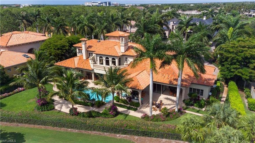 This vibrant and luxurious estate home in the very private Estates at Bay Colony Golf Club is nestled among an enclave of 75 estate homes, with membership to the exclusive Bay Colony Beach Club included. Situated on a cul-de-sac, this estate home rests on the third hole of the championship course and enjoys a beautiful southwestern exposure from the private backyard.  The home boasts five bedrooms plus an office, six bathrooms, one half bath, formal living and dining room, spacious kitchen, incredible outdoor kitchen, motorized blinds and plantation shutters, gas fireplace, guest suite, and spacious master suite. A three-car garage with a separate golf cart garage are accessed by the second driveway. Gorgeous landscaping throughout the property gives a colorful and extravagant feel from both the road and your lanai. Upstairs you will find 3 en-suite bedrooms, a wet bar, along with a balcony overlooking the pool and spa and golf course.