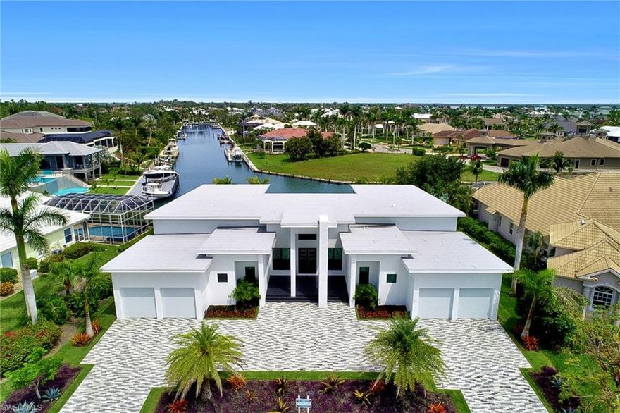 New contemporary smart home. Direct access. This furnished home has 5 bedroom, 5.5 bath with a
private cabana room, movie theater, den, 4 car garage,
negative edge pool, spa and an outdoor summer
kitchen, this home will be your buyers dream.