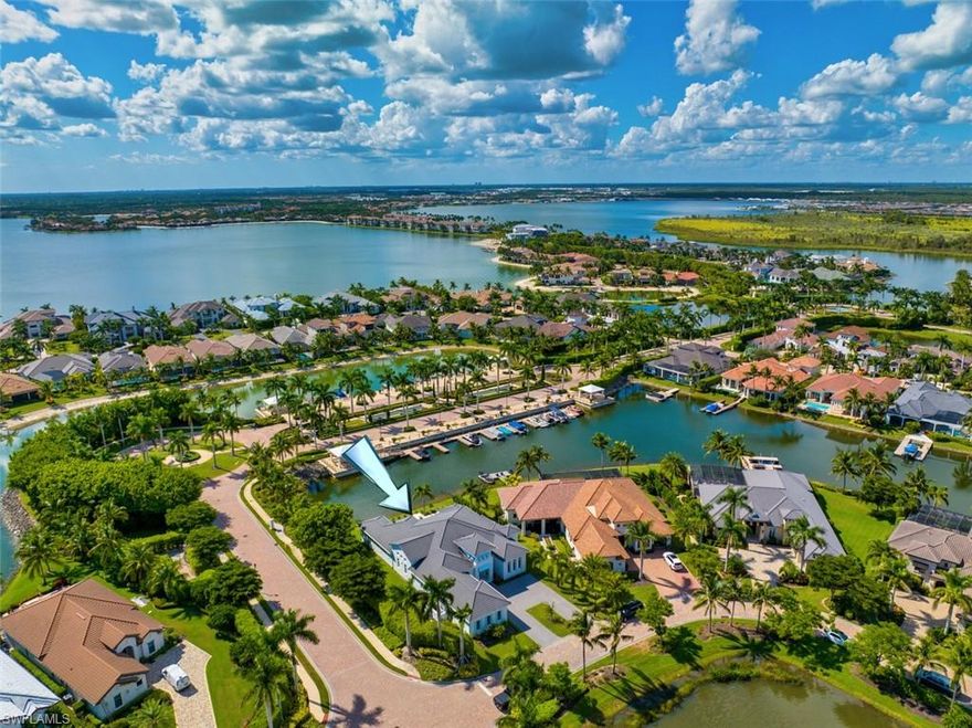Move in NOW! Stunning, like-new waterfront custom Gulfshore Home in #1 Miromar Lakes Beach & Golf Club. 4168 air-conditioned square feet of soaring architectural ceiling details, designer lighting and the finest finishes distinguish this Estate Home in Salerno on the Peninsula at Miromar Lakes. Renovation just completed includes new 12-inch wide white oak Legno Bastone flooring throughout, European floating ledge kitchen-island design, added butler's pantry with French doors, designer hardware, new Kucht Professional eight-burner range, and Kronos Terrazzo tile throughout the outdoor living area. Buyer will be responsible for installation of dock and completing the paver project in the pool area. Three-luxurious en suite bedrooms, plus office, and half bath. Fully painted inside and out, new landscaping. 3-car air-conditioned garage, spacious outdoor lanai with roll-down screens, summer kitchen, linear fireplace, custom pool and spa with fire/water features. Dock rights included.  Stunning western sunset views, boat from your backyard to the award-winning amenities. Never lived-in since completion of renovation. Don't wait to build, this bespoke property is move-in ready this season for the discerning buyer looking for the finest finishes and lifestyle.