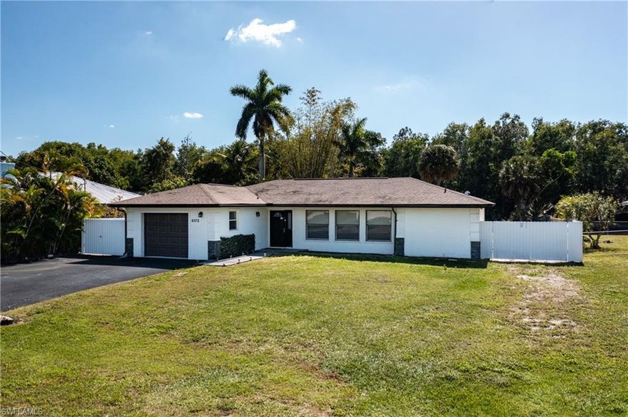 Welcome to this charming 3-bedroom, 2-bathroom home. Boasting 1531 square feet of living space on a generous lot, this property offers a delightful blend of comfort and waterfront living.

Step inside to discover the inviting interior featuring tile floors throughout. The central AC (new in 2022) and heating ensure year-round comfort, while the southern exposure fills the home with natural light. The garage has been thoughtfully converted into a permitted bedroom, complete with a kitchenette, offering flexibility, and Airbnb possibilities.

Outside, the private outdoor space is a true oasis. Take a dip in the caged pool, which benefits from solar pool heat for enjoyable swimming year-round. With canal frontage and stunning canal views, this home is a paradise for boating and jet skiing enthusiasts. There's ample room for a dock, and the property even offers space for an RV next to the house with a gate for easy access.

This home is perfect for those seeking a serene waterfront lifestyle and is sure to impress!
Don't miss the chance to make this waterfront retreat your own. Book your showing today and experience the allure of canal-front living in Naples, FL!