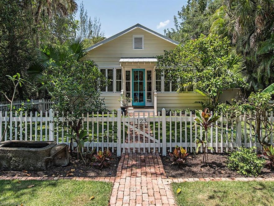 "Periwinkle Cottage," featured in “Dream Houses: Historic Beach Homes and Cottages of Naples,” is located in the heart of the Old Naples historic district, just one block to the beach and three blocks to Third Street shops and restaurants. The original 1935 two bedroom/two bath cottage has been faithfully maintained and was updated in 2001 with impact windows and metal roof. The wide, classic closed-in front porch overlooks orange trees and broad lawn with picket fence, and opens inward to a beamed ceiling living room with fireplace and a den/library. A cozy dining area compliments the kitchen which overlooks a brick paver pool courtyard. There is also a separate laundry room and large AC storage room that could be an office or art studio. The back portion of this unique cottage was all new in 2001 and features charming one bedroom attached guest quarters with high beamed ceiling living room with fireplace, wainscoting, built-in seating and a small kitchen. Plus there is a large guest bedroom over the garage. This is a once-in-a-generation opportunity to own one of Old Naples’ most charming historic cottages. Recent land appraisal is $2.9M. Sold "as is. Seller is licensed agent.