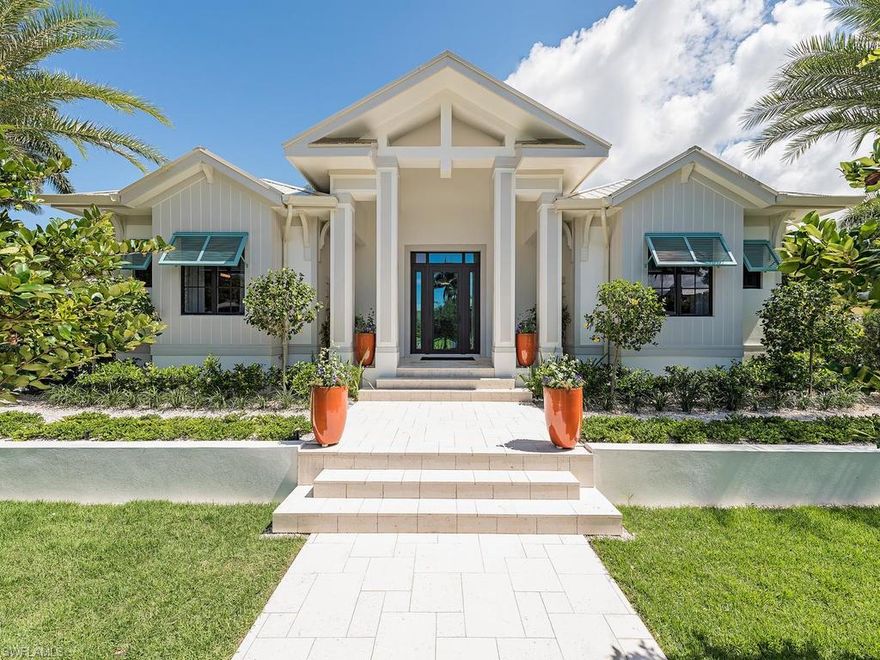 H.12075 - An exceptional Olde Naples luxury home built in 2017, fashioned with classic, timeless architecture while designed for livability with transitional elegance.  As you enter through the sleek and sophisticated entrance you will find yourself in a timeless domicile that is exquisitely refined.  Features include classic 5-V Crimp metal roof, wood flooring throughout, intricate coffered ceilings, custom lighting, gourmet kitchen, wet bar with wine chiller, 3-car collector's garage and much more! Gourmet kitchen includes ample beautiful countertops, large island with sink and breakfast bar, top-of-the-line Thermador appliances, double wall ovens and custom cabinetry.  Spacious Master Suite has pool walk-out, his & her walk-in closets, recessed lighting & boasts a beautiful master bath.  The outside lanai has preferred Western Exposure and features a beautiful summer kitchen, covered & uncovered spaces and is surrounded by lush, tropical environs.  This is a home that must be seen to be appreciated.  Advantageously located nearby Crayton Cove and close to the famous 3rd Street shopping/dining district.  Come live the Olde Naples lifestyle in this exceptional new luxury home!