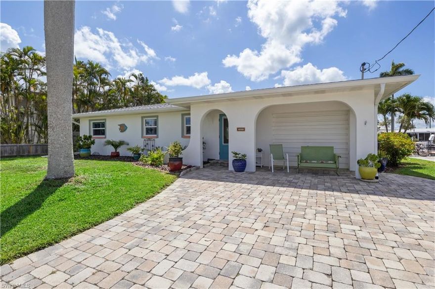 Step into a slice of Old Florida charm with this beautifully updated island cottage nestled at the quiet, scenic end of Island Avenue and Janet Street in Matlacha—a vibrant, artsy enclave where mermaids feel right at home and the sunsets paint the sky in watercolor hues.

This direct Gulf access gem comes with no bridges, a wide and deep canal, and you're just one minute to open water—perfect for spontaneous boat days or peaceful paddles through mangroves or the Great Calusa Blueway - a 190 mile marked kayak trail - launch your kayak off your dock, and yes, there's a boat lift and dock (with the option to purchase the boat, too!).

Inside, this cottage has been lovingly transformed with a clever use of space and style. The kitchen now features a center island perfect for sharing stories over coffee or crafting the catch of the day. Enjoy cool porcelain floors with an Italian Torgenol design, storm-rated doors and windows, updated bathrooms, oversized bedrooms, and a cheerfully epoxied garage floor in bold yellow and green—just begging to be a creative studio or beach toy haven.

Take your morning tea under the inviting pergola or watch the birds flutter from your screened-in lanai, where Roseate Spoonbills, ospreys, and doves are your daily audience. And don’t worry—flood barriers have been ordered, adding an extra layer of hurricane protection to this island retreat.

Beautifully updated and ready for a new owner.

Matlacha is more than a place—it’s a lifestyle full of whimsy, water, and wonder. Come see what makes this magical village and this island home so unforgettable
