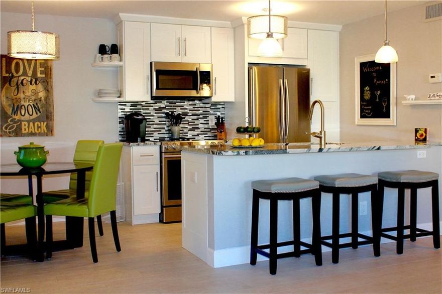 Fabulous Old Naples 2 bedroom 2 bath condominium only 3 blocks from the sugar white sandy beach and just a block from 5th Ave shops and restaurants.  Courtyard access to this light and bright first floor end unit completely renovated in 2016 with beautiful wood look tile floors throughout, gourmet kitchen with stainless steel appliances, white Shaker style cabinets, and dining area. Living area is large with access to your own private lanai space.  Unit has private laundry facilities and has been professionally decorated and offered turnkey furnished with everything you need to enjoy the Naples lifestyle.  Large separate storage unit also comes with this property for those beach chairs.  Complex also has a public laundry area.  Great investment opportunity - rent during season for one month is approximately $6,000.