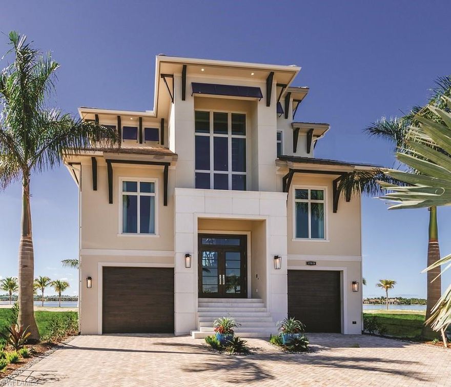 Situated on a lakefront home site that offers long range water views, the Sabbia’s architectural design is reminiscent of modern coastal styles. The home’s main entry is flanked by two garage areas, one of which is 67 feet long. The entry leads to the lower foyer and elevator as well as storage areas, the optional recreation room, a bedroom and a beach patio. Three guest suites with full baths, an immense great room with a sit-down bar, refrigerated wine storage and built-in media center, kitchen with a catering pantry and island seating, a dining area and a powder bath are on the first living level. The stairwell features a two-story window that brings additional character to the architectural design. The great room opens to an outdoor living area with a fireplace, gas grill and refrigerator, a pool bath, dining and conversation areas, elevated pool and spa and a sundeck all of which overlook Miromar’s signature lake views. Truly a must see!