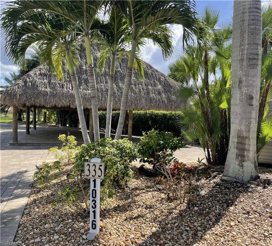 Welcome to Lot 335, one of Cypress Trail RV Resort's bigger Lake View lots. Since 2016, the original owner has made numerous outstanding improvements.  The lot includes a two-zone irrigation system that has been professionally installed and maintained. The lot is filled with palm trees and associated plants. This list includes Canary Island Dale Palms, Sylvester Palms, Fishtail Palms, Calussias, Christmas Palms, Paurotis Palms, Crotons, Tree Gardenia, and King Sago. It also includes a large Tiki Hut, which was installed in 2017. The pavers that were installed throughout the lot brings out the beauty of this property. The layout of the pavers on top of the paved RV pad provides a little more height, improves drainage and reduces any potential flood risk. You can also take use of the extra elevated pavers beneath the tiki, which keep furniture and other items dry. This Tiki also features all of the necessary electrical outlets and power to accommodate any desired entertainment. This lot also includes a 50% FINISHED AMAZON 10X12 shed, which was installed in 2017. The panel, outlets, and switches are located between the shed and the Tiki. Smart switches are put in the shed and on the Tiki Hut to allow remote control of the lot's lighting. Electrical, insulation, a vapor barrier, and bathroom framework have all been installed in the shed. Outside the shed, sewer and water lines have been roughed in for future completion. Outdoor Kitchen Rough-in has been installed beneath the tiki for an outdoor kitchen, including drain, water, and low voltage cabling for network and cable television. Electricity is supplied by a pipe that connects to the Tiki Hut's power panel. Two outlet posts are located along the pavers in front of the Tiki, facing the lake.
Additionally, to help drain the lot quickly after rain events, a weeping tile was installed (buried) around the concrete base for the shed and then travels along the southwest side of the Tiki Hut to the grass area in front of the lot towards the lake. The lot has been setup for Low Voltage Installation, including cable, hardwire network cabling and wireless networking. The hardwiring includes cable and RJ45 cables located at four different locations. Two on the posts of the Tiki Hut a third one at the lot power post and the fourth at the kitchen (not wired yet) rough-in. The wiring all comes into the shed in a very neat and tidy network area. The wireless system consists of three Ubiquiti UAP Mesh network modules. The network provides very strong and reliable wireless connectivity.
There outdoor furniture and grill are negotiable.