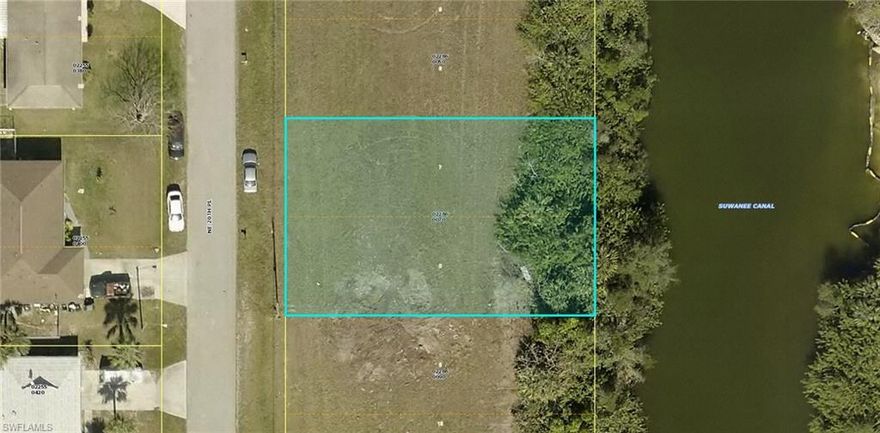 Come see this fabulous, residential lot in NE Cape Coral. This lot sits on the Suwanee Canal and will provide you with miles of freshwater to enjoy either fishing, boating or paddle boarding. The location cannot be beat as you are close to shopping, restaurants, parks and golfing to just name a few. Come check out this lot before someone else snaps it up. This area is growing fast with new, beautiful homes popping up all around this desirable neighborhood. Cape Coral is booming and now is the time to secure you piece of paradise.