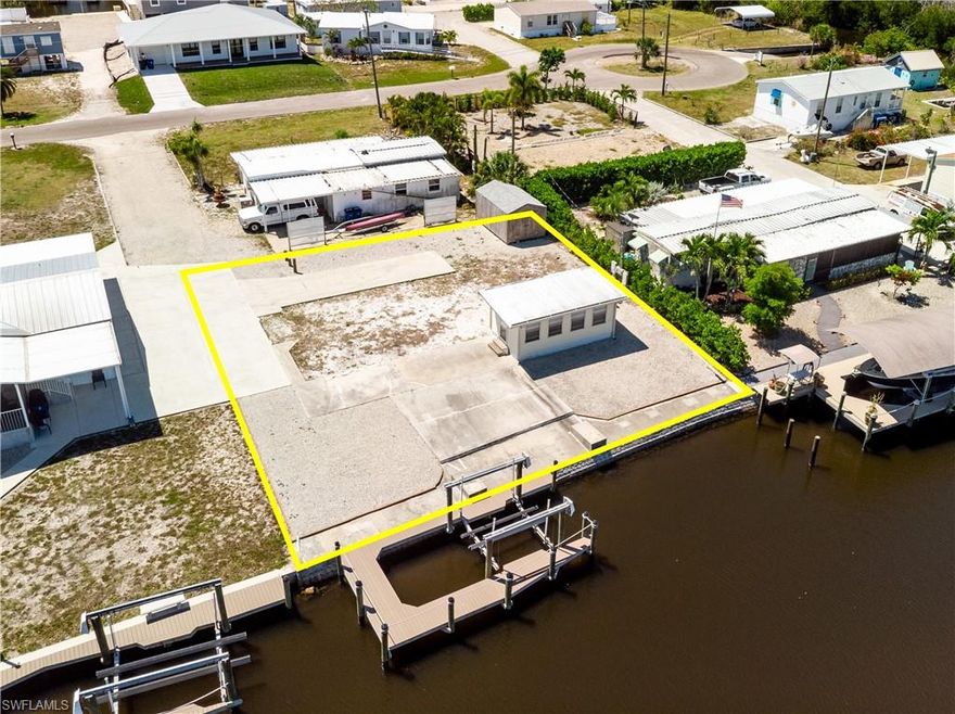 Large canal lot with a fast and easy out to Pine Island Sound. A large shed is also there. The dock has Trex decking, and includes a large 8,000# boat lift. This property offers a fantastic opportunity for a fresh start in the desirable Flamingo Bay community! The lot presents a blank canvas for your new dream home. Situated on 2/3 of a full lot from the canal, buyer will benefit from saving on impact fees. Flamingo Bay offers a welcoming community with a voluntary HOA. Membership provides access to fantastic amenities, including a recently upgraded pool, shuffleboard courts, a horseshoe pit, and a boat launch. The initiation for the voluntary membership is $500, with an annual fee of $275 per person. Don’t miss out on this chance to make this space your own and enjoy all that Flamingo Bay has to offer!