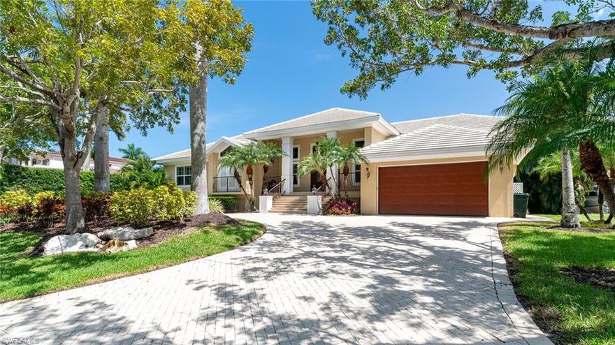 This bright, airy, and charming home is a waterfront living dream on Duck Channel in Aqualane Shores.  Park your boat in your backyard that includes a 63’ boat dock and additional boat slip with hoist.  This Naples Island retreat boost a color palette of sand, surf, rich woods, & plantation shutters throughout.  Master bedroom opens to a private screened porch & enjoys all that living on the water in Naples offers. Large sunny pool, spa and deck include covered loggia with an electric screen enclosure and completes this five-bedroom, three bath residence.  White sand beaches on the Gulf of Mexico awaits, Historic 13th Avenue, 5th Avenue shopping and dining are all a short walk or bike ride away.  This is beyond your desirable location in Naples, FL and this home has the potential and inherit charm to be your Florida dream home!  Endless possibilities!  NEW ROOF ON ITS WAY!!!