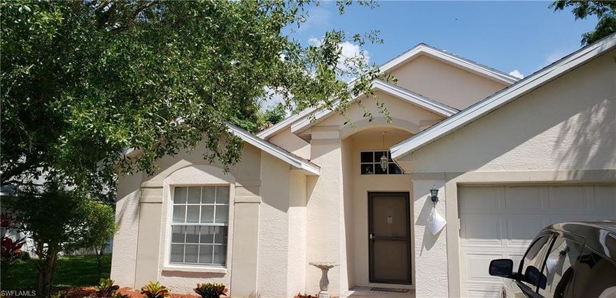 This Waterfront house has it all!  If you are looking for a safe gated community with super low HOA fees, sidewalks for your kids to ride their bikes, take a jog, and has its own playground and park, then look no further.  This 3 bedrooms 2 bathrooms 2 car garage waterfront home features its own fireplace and great room floor plan.  The kitchen is huge with its numerous cabinets, Black appliances, and stone accents.  High vaulted ceilings give you all the room.  Split floorplan keeps the kids on one side and the adults on the other.  Master bathroom features duel sinks, vanity area, and a big walkin closet. Screeded lanai faces your huge lake and preserve.  Super quiet and private.  Located within walking distance to elementary, middle and Lehigh Senior High School. Close to fabulous white sand Beaches, Coconut Point Shopping Center, FGCU, Golf, Marina's, Theater, Entertainment and so much more. Schedule your showing today, you will be glad you did!