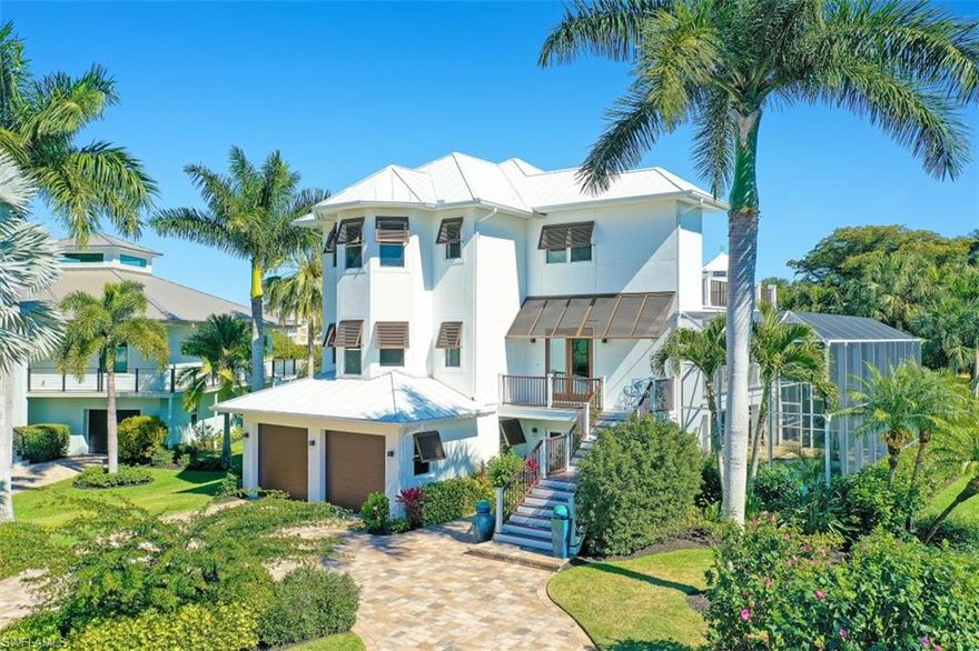 Unparalleled in finishes & furnishings, this Southport on the Bay lakefront home with captivating Bay views is like no other. Enjoy direct Gulf access from your private deeded boat dock & lift at the rarely available Southport Yacht Club just steps away. This open & light-filled coastal style estate offers an impressive array of renovations, from the engineered hardwood floors to impact doors/windows & more. Perfectly situated to take advantage of Southern exposure for dazzling lakefront sunsets & optimal sun on your pool. Gourmet kitchen is outfitted with Bosch appliances & features an elevated eat-in bar. The brand new gas fireplace is the focal point of the wide-open living room. The magnificent owner’s level is nestled away for optimal privacy & is accessible via elevator or stairs. The owner’s suite features private lanai access with commanding views of the lake & Bay, along with a modern master bath with dual vanities & spa shower. 4 guest rooms, 5 full bathrooms, & 2 den/offices offer tranquil retreats for your guests, including a separate kitchen & living area. Sliders on 3 levels create the ideal indoor/outdoor experience. This beach & boaters retreat is move-in ready!