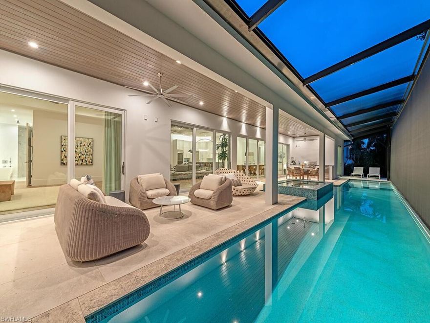 Experience the epitome of luxury living at 4234 Crayton Rd, where elegance meets unparalleled comfort. Nestled in the prestigious Park Shore neighborhood, this remarkable residence is elevated above standard construction codes, ensuring exceptional safety and resilience for peace of mind. This exquisite home features four spacious en-suite bedrooms, two elegant half-baths, and a sophisticated den, all thoughtfully designed to embrace the quintessential Florida lifestyle. As you enter, you'll be greeted by a beautifully furnished open-concept living area that flows seamlessly into a gourmet kitchen, showcasing top-of-the-line Wolf and SubZero appliances, complemented by a stunning waterfall island—a true paradise for culinary enthusiasts. Perfect for entertaining, the expansive outdoor living space beckons with a luxurious spa, lap pool, and an outdoor kitchen, all adorned with rare large-slab shell-stone decking. The interiors are further enhanced with wide plank European wood floors and single-sheet porcelain bath floors, radiating sophistication and style. This extraordinary home is equipped with impact windows and doors, solid mahogany garage doors, and WiFi-enabled components, allowing for effortless control and monitoring from anywhere. Enjoy the convenience of walking to the beach and Venetian Village, or take a short golf cart ride to the vibrant shopping, dining, and entertainment options of 5th Avenue and 3rd Street. Investing in this stunning property means prioritizing your family's security, comfort, and a lifestyle that is truly extraordinary. Embrace the luxury you deserve in a home that is not just a residence, but a sanctuary.