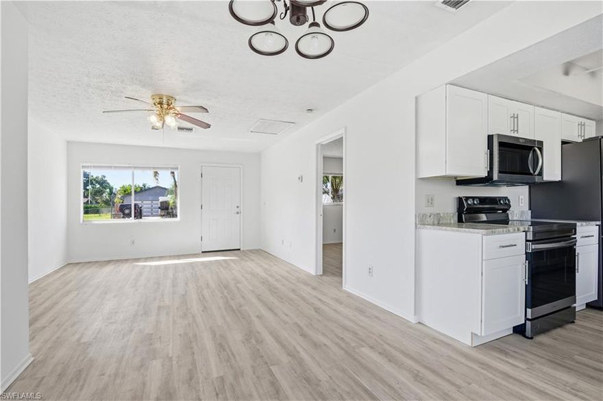 Welcome to your slice of paradise in Northeast Cape Coral! This delightful 3-bedroom, 2-bathroom single-family home is perfectly situated on a peaceful cul-de-sac, offering minimal traffic and a relaxing atmosphere. The generous backyard space provides ample room for outdoor activities. Features a desirable split floor plan layout for privacy, with a master suite that includes an ensuite bathroom. The home includes brand new cabinetry, luxury vinyl plank flooring, refrigerator, microwave and a single-car attached garage for parking and storage.  This home boasts a fantastic, convenient location near Del Prado Boulevard, providing quick access to shopping, dining, and local amenities, including the nearby Lowe's. Enjoy the quiet neighborhood while still being moments away from everything Cape Coral has to offer!