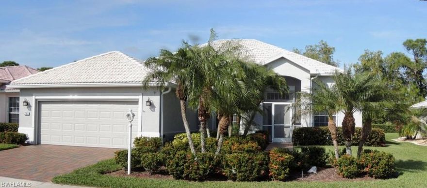 Priced below the market and move-in ready.  You just cannot miss with this home!  As you step inside the front door, you feel right at home  The recently painted rooms are spacious and bright and flow easily from one to the next.  The kitchen has all new stainless steel appliances and updated Cornerstone cabinetry.  Floors in the kitchen, bathrooms and family room are tile.  All other rooms have beautiful, gleaming hardwood flooring.  There is a newer, high-efficiency air conditioning system.  The electrical system has been upgraded to accommodate a generator.  The paver driveway leads to a large garage with new door and new retractable screen.  The garage floor has been professionally refinished with an epoxy surface.  The exterior of the home has been recently painted and every window and door has accordion or electric roll-down shutters.  The extended lanai, with its new screen cage overlooks the landscaped back yard with tranquil pasture land beyond.  There is space for a pool.  What more could you want?  All this comes with a one year Home Warranty for your peace of mind.