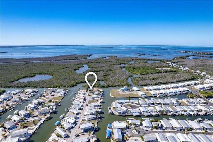 Calling all boaters, fishermen and island explores. Waterfront manufactured home in St James City. 2 bedrooms 2 baths, furnished with an open floor plan. Per owner home has never flooded. 10,000 lb. boat lift. Direct access to Sanibel, Captiva, Cayo Costa, North Captiva, Useppa, and Boca Grande. Home has a metal roof and also includes a carport and workshop. Go to local restaurants by boat or golf cart! Property is ideal for full time residence or a vacation rental.