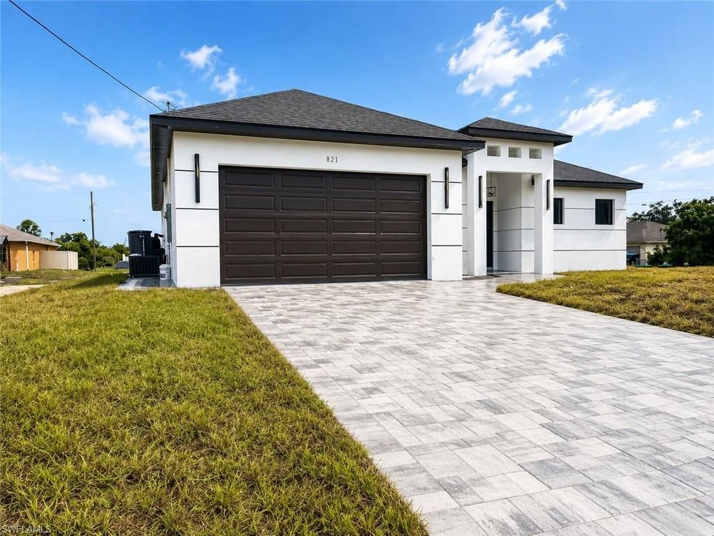 Photo of 921 Martha AVE S, LEHIGH ACRES, FL 33974 (MLS # 226020280)