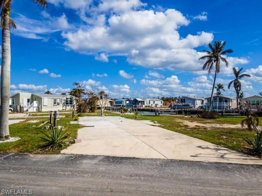 Imagine the freedom to create your perfect getaway on this versatile vacant lot in Port Carlos Cove, one of the hidden gems near Fort Myers Beach.  Whether you're dreaming of a cozy mobile home retreat or a site built coastal escape, this lot gives you the flexibility to make it truly yours.
Port Carlos Cove offers the chance to live just minutes from the Gulf of Mexico without sacrificing peace and privacy.  Imagine waking up each morning with easy access to the water for fishing, kayaking, or an afternoon boat ride. For beach lovers, the soft sands and beautiful waters of Fort Myers Beach are just a short trip away, while the vibrant local dining, shopping, and entertainment make every day feel like a vacation.
This lot offers everything you need to build the lifestyle you've dreamed of, with low HOA fees and a relaxed, welcoming community that's perfect for seasonal or year round living.  So whether you're looking to set up a comfortable mobile home or plan a more custom build, this lot in Port Carlos Cove is your blank canvas.