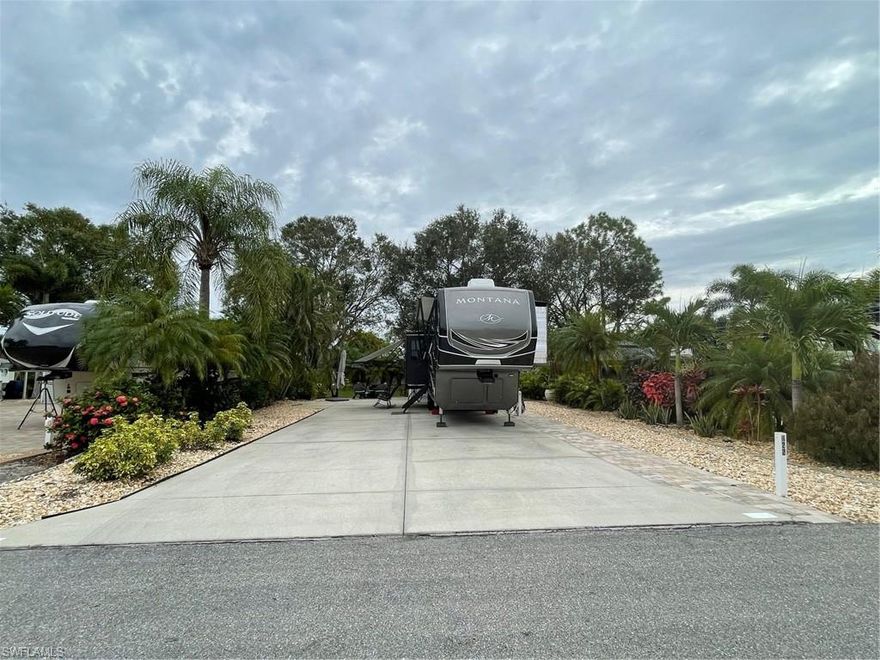 This oversized rv lot is across from one of the community lakes. It offers a well appointed accessory shed with plumbing and electric. This is a beautiful community that features two pools, a billiards room, gym, library, community laundry, and even a day spa.