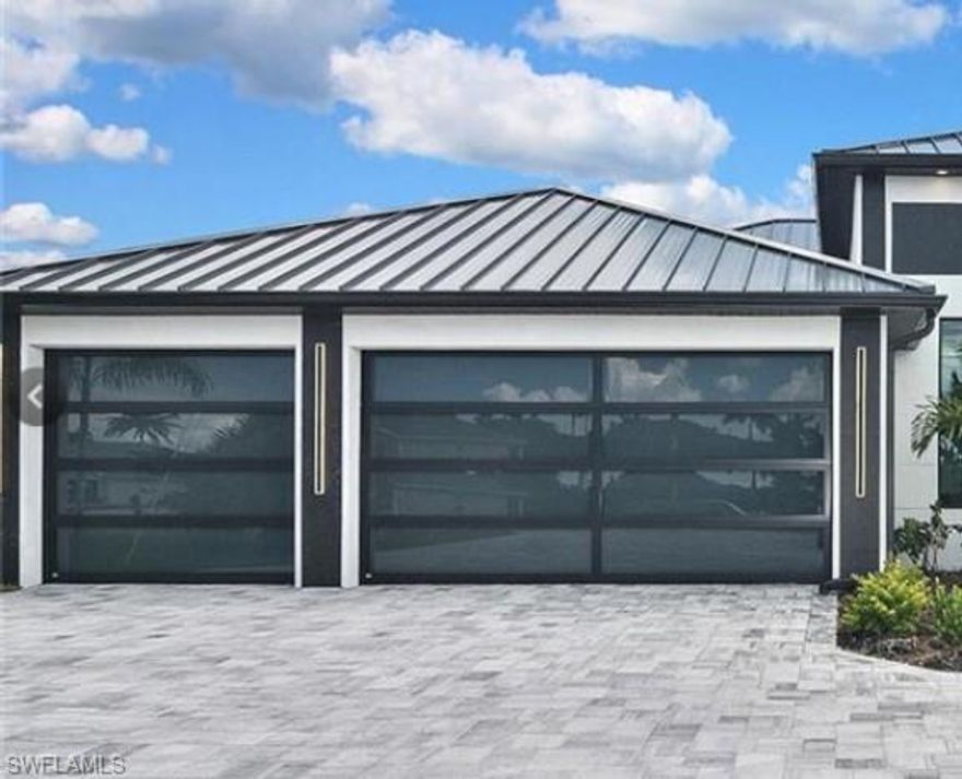 Welcome to this beautiful NEW CONSTRUCTION GULF ACCESS HOME, BOATERS DREAM LOCATION with only 35 minutes to open water!! Southern exposure, 10" slider doors to the lanai with a 90 degree disappearing corner. HIDDEN PANTRY, POOL & SPA home with clear view/picture frame pool cage, OUTDOOR KITCHEN with large refrigerator, electric interior FIREPLACE. 3 bedrooms/3 full bathrooms /3 car garage with GLASS DOORS, PAVER CIRCLE DRIVEWAY that will fit 10+ cars, all windows and doors are hurricane impact, built-in SURROUND SOUND SYSTEM with 8 speakers in and outdoor. Built-in custom cabinets in all closets. OVERSIZED LOT 0.26 acres.
This ELEGANT and TIMELESS designed home with high-end finishes will be ready at the end of May but there is still time to add more upgrades when needed.