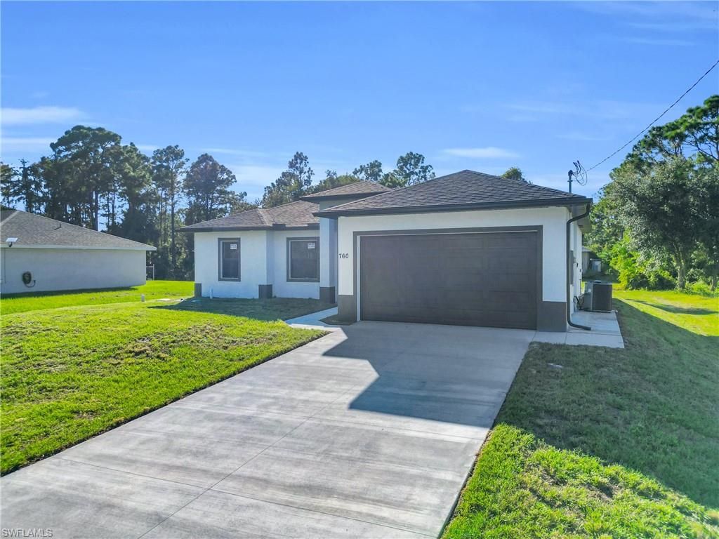 Photo of 760 Fullerton AVE S, LEHIGH ACRES, FL 33974 (MLS # 2025018055)