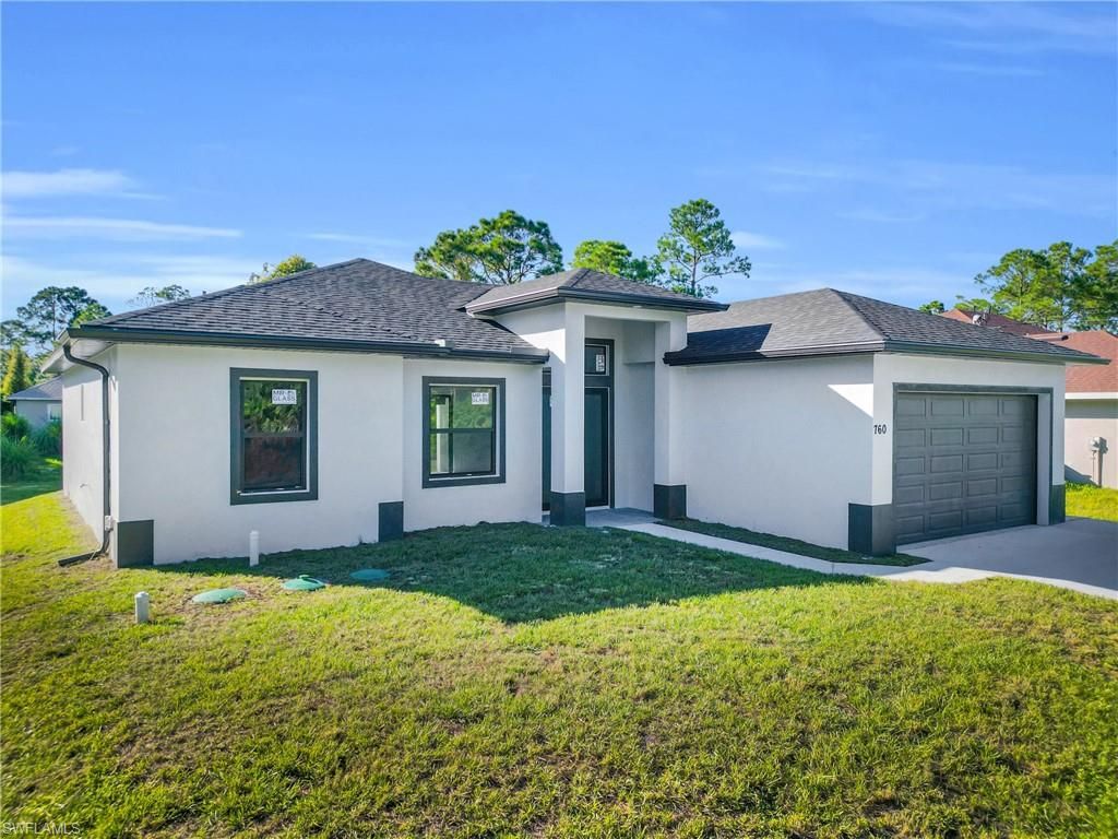 Photo of 760 Fullerton AVE S, LEHIGH ACRES, FL 33974 (MLS # 2025018055)