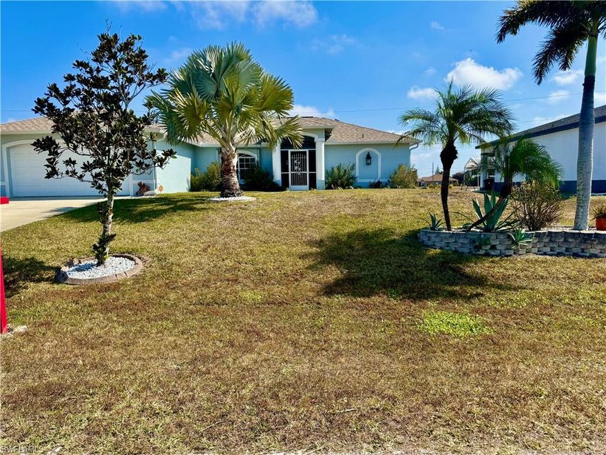 Beautifully updated pool home in Cape Coral. Over $250K in recent upgrades. Stunningly remodeled chef's kitchen with all new soft close cabinetry, tons of storage space with lots of designer pull out drawers, all newer appliances, double oven, beautiful quartz counters, and huge island perfect for preparing gourmet meals. The open concept floorplan is perfect for entertaining with soaring cathedral ceilings, a formal dining area, and huge triple sliders that pocket to open the entire living area to the outside space. Spacious owners suite also has sliders out to the pool area, large walk-in closet, and recently updated bathroom with dual sinks and walk-in shower. The split bedroom floor plan offers two additional spacious bedrooms and the newly updated guest bathroom that also functions as a pool bath so you and your guests can use the bathroom directly from the pool area. You will love the outside space with a large covered lanai and extra large screened in pool. The lanai features electric roll down shutters for ease of storm protection. There is also a spacious deck outside of the caged area for lounging or grilling, a large mature avocado tree, a new 10' X 8' shed for extra storage, and the backyard is fully fenced for your furry friends. The home had a NEW ROOF and HVAC system installed in 2022. Pay little or no electric bills with the newly installed SOLAR PANELS that are PAID IN FULL with battery back up to power your home during power outages! There is even an EV charging station in the garage. Schedule your showing today and start enjoying the SW Florida lifestyle!