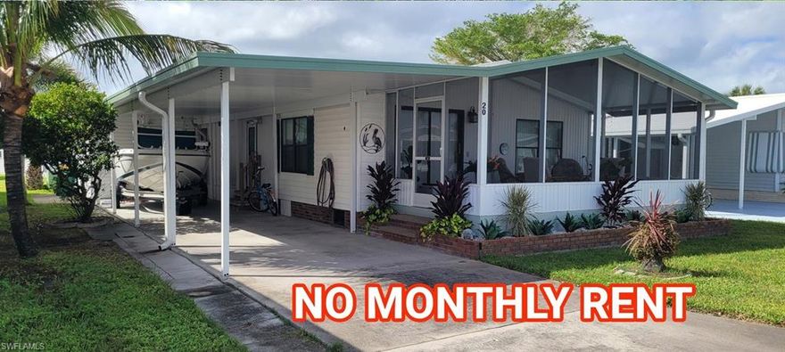 1985 1100 sq ft Double Wide Manufactured Home on an owner occupied Lot, within an organized co-op. 55 plus, no pet community, attached carport, screened lanai.