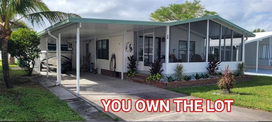 1985 1100 sq ft Double Wide Manufactured Home on an owner occupied Lot, within an organized co-op. 55 plus, no pet community, attached carport, screened lanai.
