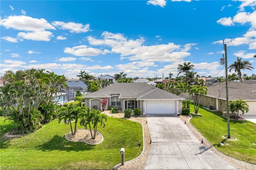 Check out this exceptional find with numerous updates, located in the highly desirable SW Cape Coral neighborhood. Surrounded by multi-million dollar property, this home has everything you need! The coveted Southern exposure screened-in pool area is a private tropical retreat, complete with a spacious, shaded outdoor dining area under the roof truss with a gorgeous surrounding yard. 

Designed with a Great Room concept, the home offers an open and airy feel, enhanced by vaulted ceilings. When the two 90-degree pocket sliding glass doors are open, they reveal an inviting view of the pool and lanai, seamlessly blending indoor and outdoor living!

This property is perfect as a vacation rental, a seasonal getaway, or a year-round residence. Recent upgrades include a new roof in 2023, a newer electric pool heater, and newly installed level four granite throughout the home.