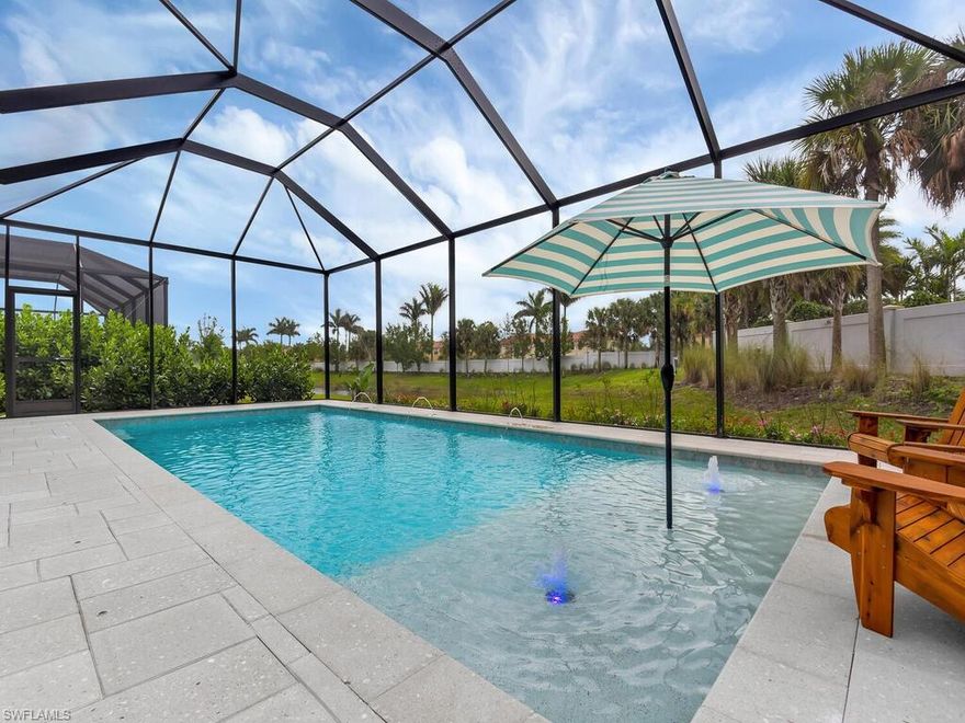 This stunning 3+ den & 2 & ½ bath coastal pool home in gated & sought after Compass Landing is exceptional in every way.  Tray ceilings greet from the foyer w the 1st 2 bedrooms to the right & ahead; the chefs kitchen & living area.  Gourmet chef's delight with KitchenAid appliances, 5 burner stove top, quartz counters, deep SS double sink, & dry bar w dual zone beverage fridge, quartz & premium vinyl flooring. Privacy is maximized outside w lake views from front porch to the backyard, located at the end of the cul-de-sac w southern exposure, custom saltwater pool, water feature, enclosed lanai, & prewired for a summer kitchen. Outdoors are brought in w 12’ sliding hideaway doors in the living area.  The primary is large with tray ceiling, luxury shower, recessed lighting, shower w jets & dual vanity. The 2 remaining bedrooms are ample in size & closet space. Sequester to the study with glass French doors off from the kitchen. Convenience is enhanced w 2 car garage, lofted storage, laundry in residence with quartz and tub, & community clubhouse, play area, & pool! Enjoy life in North Naples with all SWFL has to offer including top schools!