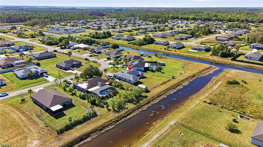 Welcome to Mirror Lakes! This well-maintained 4-bedroom, 2-bath home in Fort Myers offers 1,873 sq. ft. of comfortable living with a functional split floorplan designed for privacy and everyday convenience. Inside, enjoy a spacious layout with a mix of carpet and vinyl flooring, single-hung windows, ceiling fans, and central electric heating and cooling. The professionally installed HVAC system includes a UV light to enhance air quality and performance.

Relax and take in serene canal and landscaped views—perfect for morning coffee or evening unwinding. The attached 2-car garage provides ample storage, and the versatile interior layout is ideal for family, guests, or a home office. Located close to shopping, dining, schools, and major roadways, this home combines comfort, style, and accessibility in a sought-after neighborhood. Don’t miss your chance to call Mirror Lakes home!