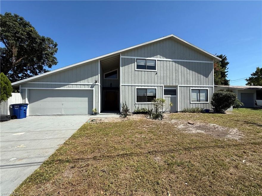 Great Investor opportunity. Spacious single-family home located in Fort Myers featuring 4 bedrooms, 2 bathrooms, and a 2-car garage. The home offers an open and airy floor plan with vaulted ceilings, loft-style architectural elements, and abundant natural light throughout. The main living area flows seamlessly into the kitchen, which includes a breakfast bar, ample cabinetry, and overlooks the living and dining spaces—ideal for everyday living and entertaining. Sliding glass doors open to a rear deck, extending the living space outdoors. Bedrooms are generously sized with laminate flooring, ceiling fans, and closets for storage. Bathrooms have been updated with modern vanities, tiled showers, and contemporary finishes. Additional features include a covered entry, interior staircase with open sightlines, and a two-car garage providing ample parking and storage. Conveniently located near shopping, dining, schools, and major roadways.