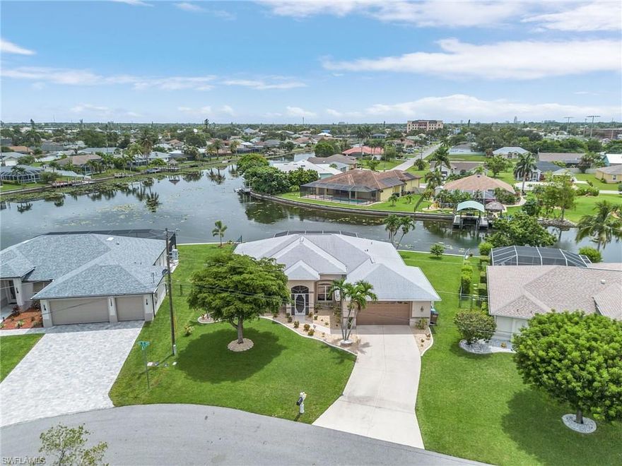 NO FLOOD INSURANCE REQUIRED! Well, renowned 2001 Tracey Built "Good Cents" Quality Home located on a freshwater intersecting canal with concrete dock and approximately125" of seawall! awaiting your boat. The canal is connected to many miles of chain lakes and canals, to enjoy boating, fishing, and kayaking. This home sits on an oversized beautiful, landscaped lot. Beautiful view of the water from almost every window! Roof installed in 2019 with Leaf Filter cover gutter in rear of home.  New pool heater installed in 2024, Kitchen recently updated & has new LG black SS appliances, granite, and back splash.  new Miami/Dade accordion shutters on lanai with new set of roll downs. Air-conditioner new 2017 and serviced regularly. All new recessed lighting installed under and above kitchen cabinets, garage and WI closet, and all new celling fans inside and out. All New carpet in all bedrooms. Close to Cape Coral Hospital & Pine Island.  Great location and close to everything.  VERY WELL-MAINTAINED HOME!