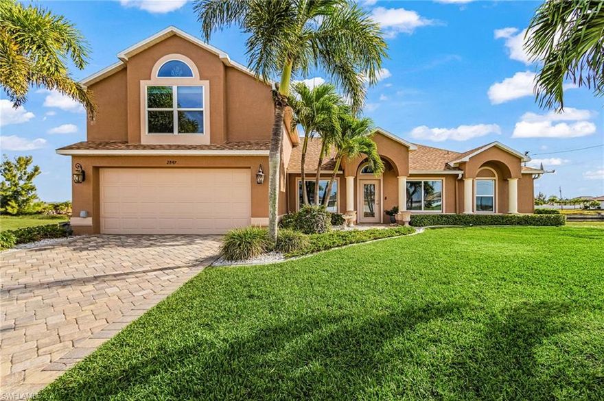 Discover pristine waterfront living in this exceptional 5-bedroom, 3-bath home located in the fast-growing and highly sought-after Northwest Cape Coral. Situated on a wide saltwater canal with direct sailboat access to the Gulf of America and no bridges, this property is a boater’s dream, offering frequent sightings of dolphins, manatees, and schools of fish right in your backyard. Enjoy year-round outdoor living with a large screened-in pool and spa, a private tiki hut on the dock, and stunning Gulf Coast sunrises and sunsets. The home is loaded with upgrades, including a new roof (2021), impact-resistant doors and windows, a new Rheem 5-ton 16 SEER AC system (2022), luxury vinyl plank flooring downstairs, new carpet in the upstairs second master suite, and a beautifully updated kitchen featuring olive cabinetry, granite countertops, and stainless steel appliances. Brick pavers enhance the driveway, pool lanai, and walkway to the dock, while a whole-house reverse osmosis system delivers crystal-clean water throughout. A solar panel system keeps energy costs exceptionally low, and the sellers will pay off the solar loan at closing, providing the new owners with decades of essentially free energy. Perfectly positioned near the highly anticipated 7 Islands Project (expected to break ground in 2026), the newly completed Crystal Lake Park, and the upcoming Tropicana waterfront park, this prime location also offers quick access to world-class fishing and boating around Sanibel, Pine Island, Captiva, Boca Grande, and Cayo Costa, along with top-tier dining, shopping, schools, golf, and everyday conveniences. Furnishings are negotiable, making this extraordinary waterfront retreat truly move-in ready. Schedule your showing today before this incrediable opportunity is gone!