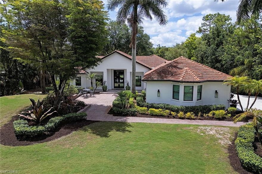 Stunning equestrian property in prestigious Livingston Woods set on 2.5 acres. Owned by a professional golfer who has installed a bunker and putting green, perfect for your short game! The residence has been totally remastered in 2021 with high ceilings, wide plank, wood-look tile floors, eight-foot solid core doors, new countertops and cabinetry in the kitchen and baths, a custom 600-bottle wine wall, impact windows, and a 2019 tile roof. Saltwater pool with picture frame screen. These are but a few of the many features of this exquisite residence. Three-car garage with mini-split air conditioner. Golf simulator-ready space in the third bay of the garage is finished with a desk, cabinets, and a fireplace. The equestrian facilities include a 220' x 92' riding arena, three-stall barn, fly spray system, A/C tack room, and paddocks. The property is totally fenced and gated with an invisible fence for pets. Beautifully landscaped with outdoor lighting and an open fire pit make for an elegant retreat. Convenient to public schools, Community School, and First Baptist Academy.