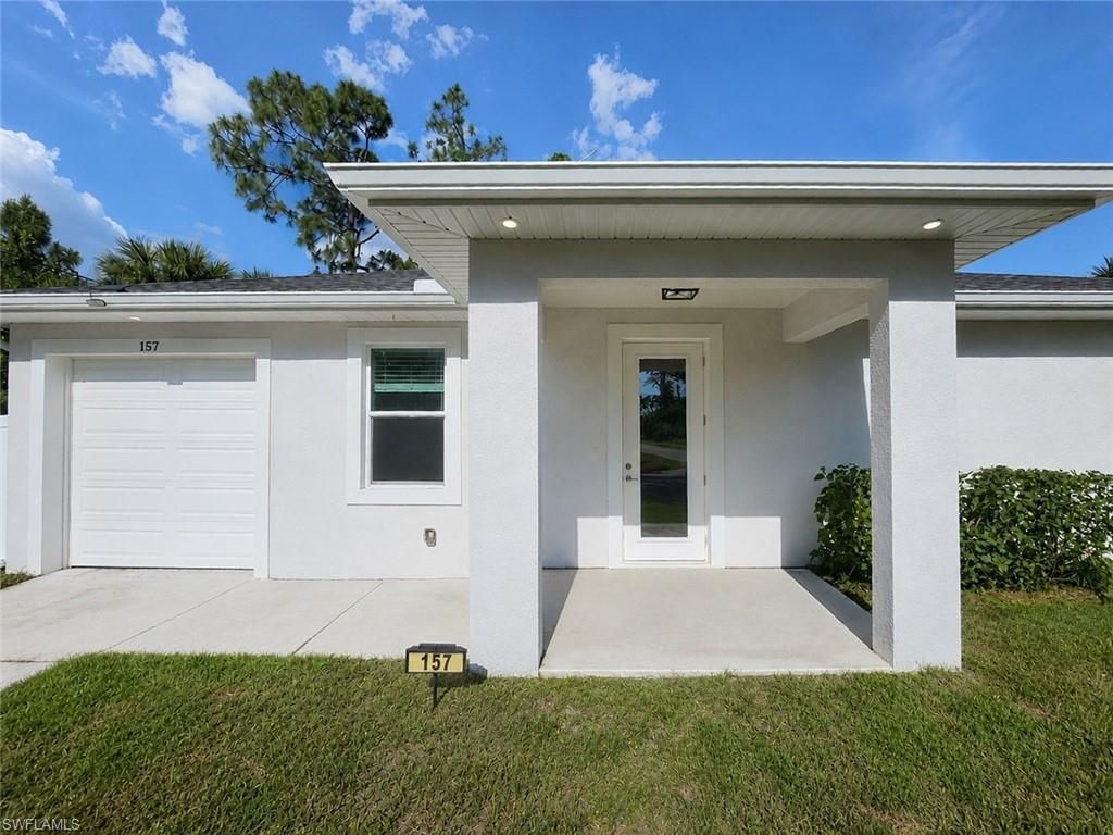 Photo of 157 Karlow AVE S, LEHIGH ACRES, FL 33974 (MLS # 226018973)