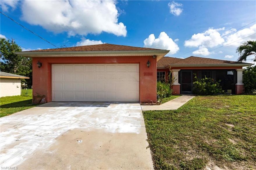 A corner lot nestled in a quiet Lehigh Acres neighborhood, this charming single-story home offers approximately 1,408 sq ft of living space. The open-concept layout includes a bright living area that flows seamlessly into a well-equipped kitchen with stainless appliances and a convenient breakfast bar. Natural light pours through large windows, highlighting the tasteful flooring and neutral paint palette. 3 spacious bedrooms including a generous primary suite with a walk-in closet and en-suite bathroom. Two full bathrooms with modern fixtures and ample storage. A two-car garage and a landscaped backyard featuring a patio—perfect for relaxing or entertaining in the Florida sunshine Along with the Veterans Park & Recreation Center and Lehigh Acres Trailhead Park nearby.