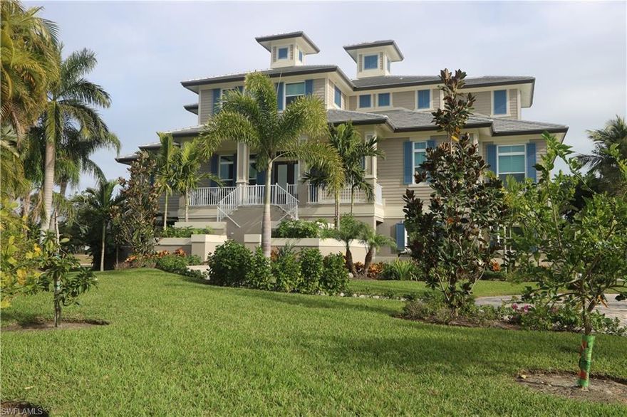 Extraordinary home designed by Marco Island's premiere architect to capture the stunning wide water views. High quality, solid construction completed by Marco Custom Builders, a Marco Island top custom builder, in January 2018. The coastal design showcases casual elegance on 4,015 Square Feet living area and over 10,000 Square Feet total area. The home offers perfect peace of mind with numerous safety and comfort features: First floor elevation at 16.5 feet, impact windows/doors plus electric shutters for lanai, 30KW generator, 1,000 gallon gas tank and alarm/surveillance systems. Two tank-less gas water heaters, instant hot water circulation system, whole-house filtration and salt-less softener system, 3 A/C systems with 2 dehumidifiers and a passive radon mitigation system. The covered outdoor-living area features a summer kitchen, impressive fire place, insect misting system and motorized insect screens and storm shutters. The home offers two master suites, two en-suite guest bedrooms, two laundry rooms and ample outdoor living spaces. The garage accommodates 4 to 5 cars. Smart flood vents, insulated garage doors and two A/C units protect high-end cars. Furniture is negotiable.