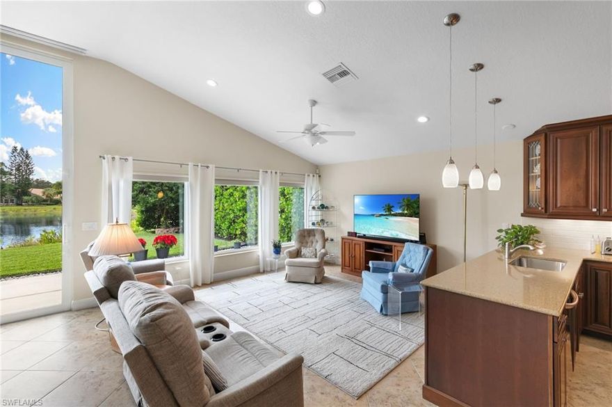 Just listed is this meticulously maintained gem of a single-story home, in the coveted Naples neighborhood of Autumn Woods. Lofty vaulted ceilings, warmly lit with recessed lighting, were opened to the central living space for a clear view through the home to the lovely lake beyond. That view is greatly enhanced by the astonishing addition of 12' high, storm-secure sliders, leading out to an elegantly constructed, unscreened patio. Many a beautiful Sunset has been witnessed there as the back faces due West! In addition, the Primary Bathroom was re-designed and the 4th bedroom was converted (can be converted back) to a dream walk-in closet! Quartzite counters and European style cabinetry in the Open Kitchen! The Air system, Roof and Appliances are new, newer or LIKE new, as is the driveway. The front of the home sits just across the street from the community clubhouse, pool, playground and racquet courts. Whether you are retiring here, raising a family or are a working professional, you will find like friends in this fabulous centrally located community that is walking distance to A-rated schools with even a back gate that takes the kids straight to the Middle School. Tucked to the sides of the community in protected preserves are peaceful walking, running, biking, walk-the-dog trails that meander through the cool trees on a paved path. This community has it all and the home is one not to miss!